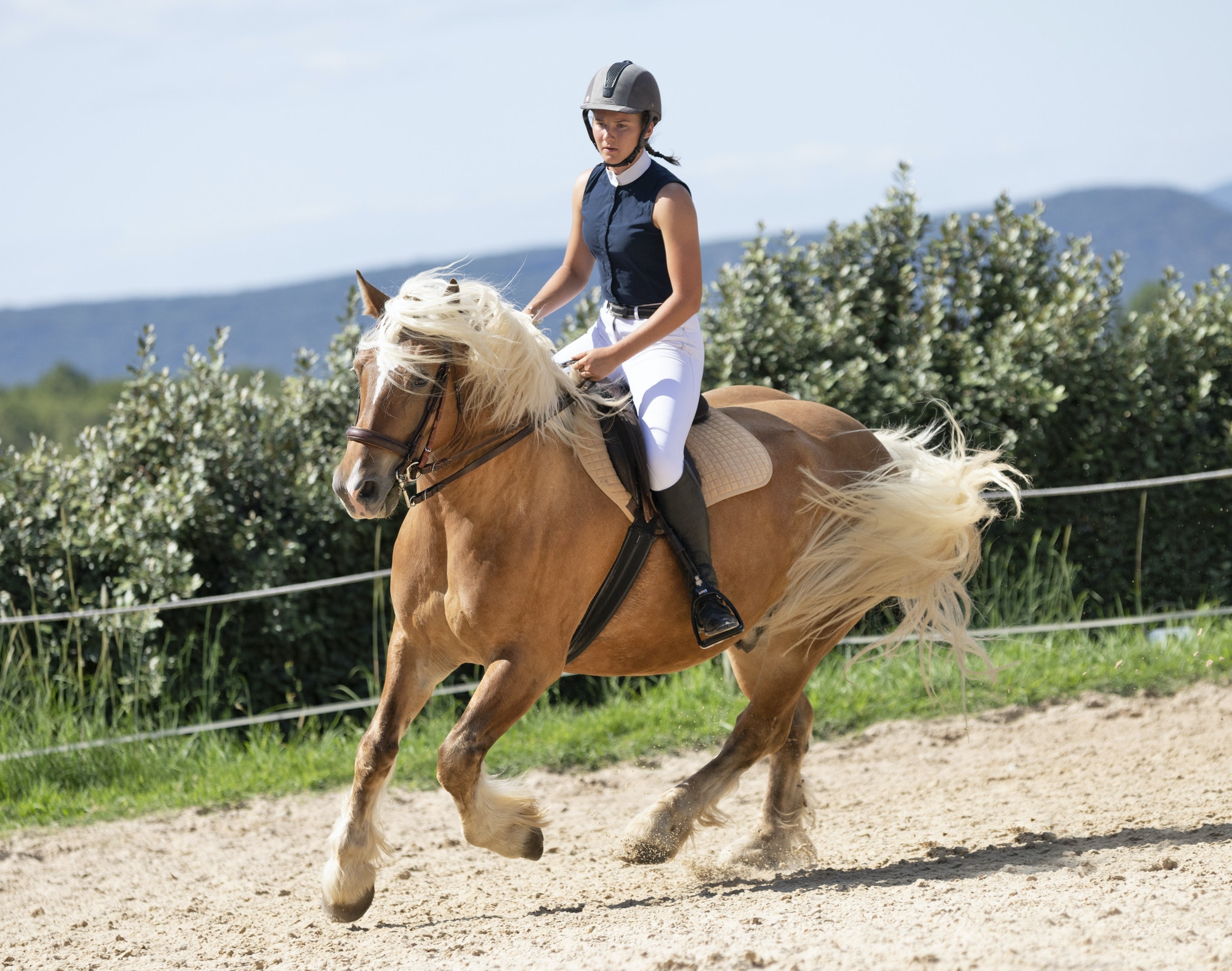 woman riding a healthy, well-functioning horse after salt therapy and massage treatments